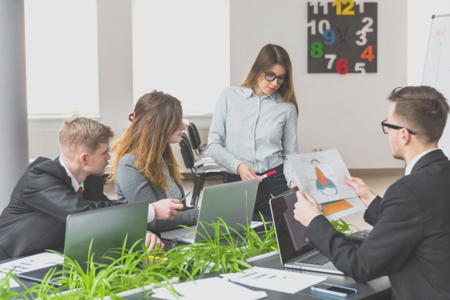 Financial professionals analyzing market data during volatile trading session